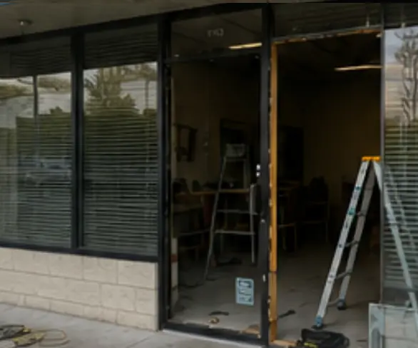 Storefront glass panel during replacement